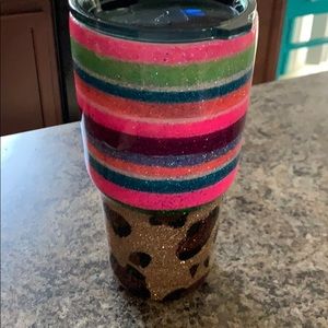 A BRAND NEW cheetah/Serape ozark trail cup.